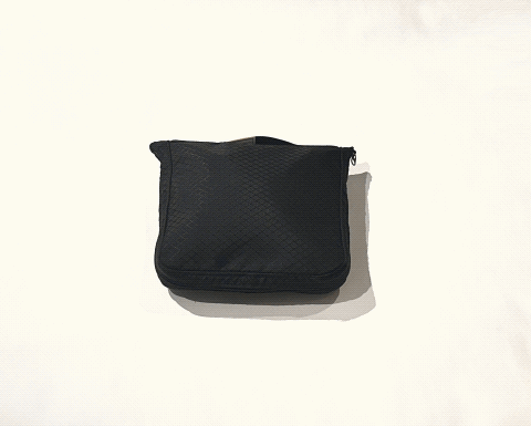A compact black pouch unfolds into a full-size bag with a shoe compartment